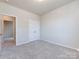 Bright bedroom featuring neutral walls and carpet at 113 Ryan Ln, Mooresville, NC 28115