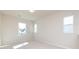 Bright bedroom with carpet, neutral walls, and multiple windows at 113 Ryan Ln, Mooresville, NC 28115