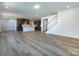 Open kitchen with island, stainless steel appliances, and hardwood floors at 113 Ryan Ln, Mooresville, NC 28115