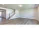 Living room with hardwood floors and staircase at 113 Ryan Ln, Mooresville, NC 28115