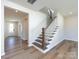 Elegant staircase with dark wood and white railings at 113 Ryan Ln, Mooresville, NC 28115