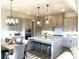 Modern kitchen with white quartz countertops and gray cabinets at 139 Dabbling Duck Cir, Mooresville, NC 28117