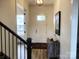 Bright entryway with stylish console table and view to staircase at 139 Dabbling Duck Cir, Mooresville, NC 28117