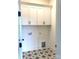 Laundry room with white cabinets and patterned floor at 139 Dabbling Duck Cir, Mooresville, NC 28117