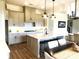 Modern kitchen with white quartz countertops and gray cabinets at 139 Dabbling Duck Cir, Mooresville, NC 28117