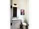 Modern bathroom with white vanity, gray marble countertop, and toilet at 139 Dabbling Duck Cir, Mooresville, NC 28117