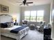 Spacious bedroom with large windows, comfortable seating, and stylish decor at 139 Dabbling Duck Cir, Mooresville, NC 28117