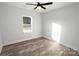 Well-lit bedroom featuring a ceiling fan and wood-look floors at 9605 Hwy 52 N None # 4, Wadesboro, NC 28170