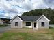 Newly constructed home with gray and white siding, black windows, and a gray roof at 9605 Hwy 52 N None # 4, Wadesboro, NC 28170