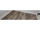Wood-look vinyl plank flooring in a light brown tone at 9605 Hwy 52 N None # 4, Wadesboro, NC 28170