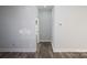 Simple hallway with light walls and hardwood-style flooring at 9605 Hwy 52 N None # 4, Wadesboro, NC 28170