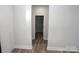 Clean and bright hallway with wood-look flooring at 9605 Hwy 52 N None # 4, Wadesboro, NC 28170