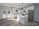 Modern kitchen with white cabinets, island, and stainless steel appliances at 9605 Hwy 52 N None # 4, Wadesboro, NC 28170