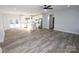 Open concept kitchen and living area with wood-look floors and island at 9605 Hwy 52 N None # 4, Wadesboro, NC 28170