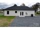 Back of the house features double doors, AC unit, and a gravel area at 9605 Hwy 52 N None # 4, Wadesboro, NC 28170