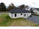 House back view with double doors, AC unit, and a gravel driveway at 9605 Hwy 52 N None # 4, Wadesboro, NC 28170