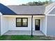 Side view of the house with a black door and windows at 9605 Hwy 52 N None # 4, Wadesboro, NC 28170