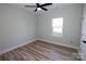 Simple bedroom with ceiling fan and large window at 9617 Hwy 52 N None # 3, Wadesboro, NC 28170