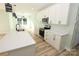White kitchen with stainless steel appliances and quartz counters at 9617 Hwy 52 N None # 3, Wadesboro, NC 28170