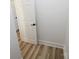 Clean hallway with white walls and vinyl flooring at 9617 Hwy 52 N None # 3, Wadesboro, NC 28170