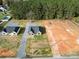 Two houses on a large lot with a gravel driveway and surrounding woods at 9617 Hwy 52 N None # 3, Wadesboro, NC 28170