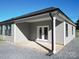 Gray vinyl-sided house with a gray roof and a covered patio at 9617 Hwy 52 N None # 3, Wadesboro, NC 28170