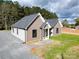 Gray vinyl-sided house with a gray roof, a covered porch, and gravel driveway at 9617 Hwy 52 N None # 3, Wadesboro, NC 28170