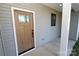 Wood front door with glass panel and black hardware at 9617 Hwy 52 N None # 3, Wadesboro, NC 28170