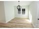 Bright dining room features a modern chandelier and light wood flooring at 9617 Hwy 52 N None # 3, Wadesboro, NC 28170