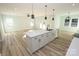 White kitchen with a large island and pendant lighting at 9617 Hwy 52 N None # 3, Wadesboro, NC 28170