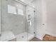 Large walk-in shower with marble tile and glass enclosure at 109 S Dunlavin Way # 62, Mooresville, NC 28115