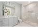 Spa-like bathroom with large shower, vanity, and marble floors at 130 Cherokee Rd # 102, Charlotte, NC 28207