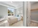 Bright bedroom with large window and neutral tones at 130 Cherokee Rd # 102, Charlotte, NC 28207