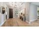 Spacious hallway with hardwood floors and art at 130 Cherokee Rd # 102, Charlotte, NC 28207