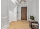 Bright entryway with elevator access and a bench at 130 Cherokee Rd # 102, Charlotte, NC 28207