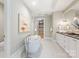 Elegant bathroom featuring a freestanding soaking tub and modern vanity at 130 Cherokee Rd # 102, Charlotte, NC 28207