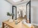 Home office with view into a hallway at 130 Cherokee Rd # 102, Charlotte, NC 28207