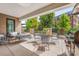 Private outdoor patio with seating area and built-in grill at 130 Cherokee Rd # 102, Charlotte, NC 28207