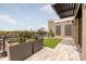 Relaxing rooftop terrace with artificial turf and city views at 130 Cherokee Rd # 102, Charlotte, NC 28207