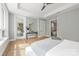 Main bedroom with ensuite bathroom and hardwood floors at 130 Cherokee Rd # 102, Charlotte, NC 28207