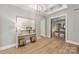 Elegant hallway with hardwood floors and access to den at 130 Cherokee Rd # 102, Charlotte, NC 28207