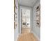 Hallway with modern art and hardwood floors at 130 Cherokee Rd # 102, Charlotte, NC 28207