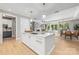 Open concept kitchen features island and breakfast bar at 130 Cherokee Rd # 102, Charlotte, NC 28207