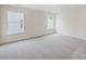 Spacious bedroom with gray carpet and two large windows at 107 S Dunlavin Way # 63, Mooresville, NC 28115