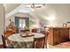 Bright dining area with round table and view into living area at 205 Vauxhall Dr, Shelby, NC 28150