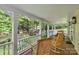 Relaxing front porch with rocking chairs and wooden picnic table at 205 Vauxhall Dr, Shelby, NC 28150