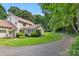 Curved driveway leading to a charming house with green lawn at 205 Vauxhall Dr, Shelby, NC 28150