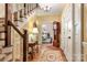 Elegant entryway with staircase, hardwood floors, and antique clock at 205 Vauxhall Dr, Shelby, NC 28150