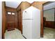 Inviting foyer with wood paneling and a full-sized refrigerator at 2020 Welborn St, Rock Hill, SC 29732