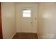 Simple entryway with wood-look flooring and white door at 710 Austin St # 124, Albemarle, NC 28001